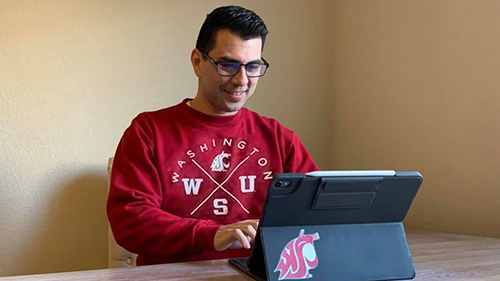 Global WSU student taking classes on a laptop